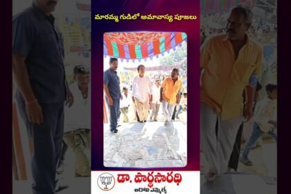MLA Dr. Parthasarathi serving devotees during Annadanam at Maramma Temple on Amavasya.